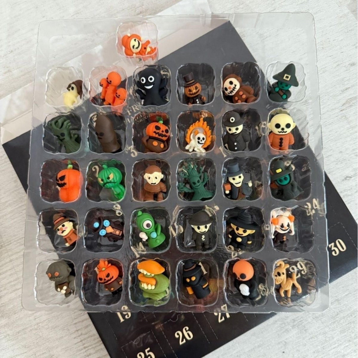 Halloween Advent Calendar Countdown with Spooky Miniature Figurines and Gothic Tabletop Decor