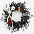 Halloween Door Wreath with Skeleton Figure Carved Pumpkins and Spiderweb Detail